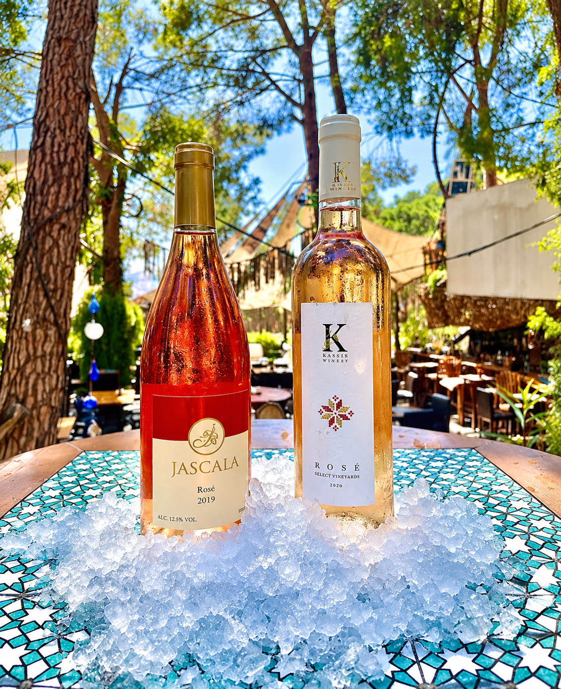 Rosé bottles at an outdoor table